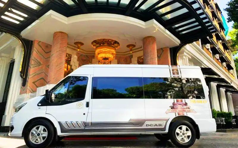 Limousine shuttle picking up passengers from a hotel in Hanoi Old Quarter.