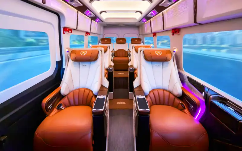 Comfortable reclining leather seats inside a Hanoi to Ninh Binh limousine shuttle.