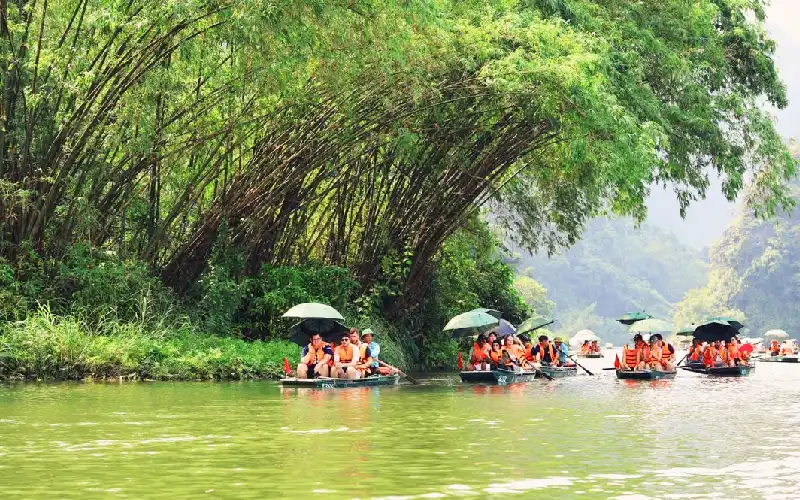 Visitors enjoying a boat tour in Trang An