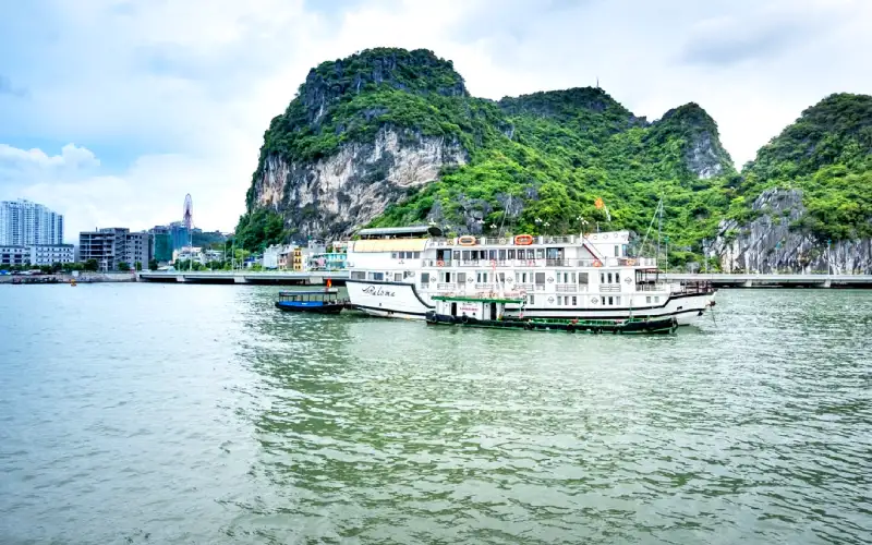 Family enjoying a Ha Long Bay cruise among limestone islands