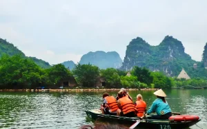Family enjoying a boat trip in Ninh Binh with kids