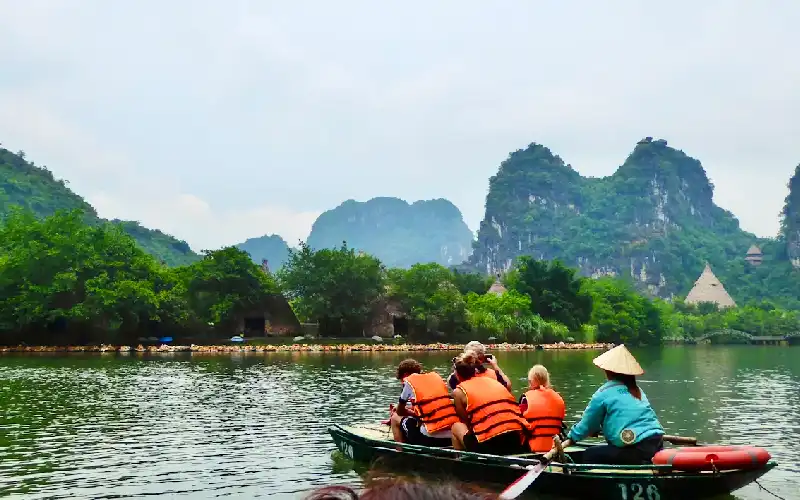 Family enjoying a boat trip in Ninh Binh with kids