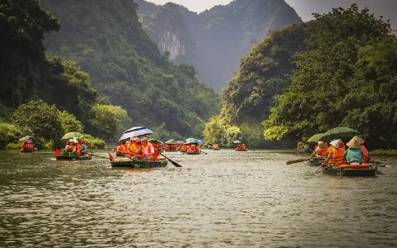 Trang An boat tour through limestone mountains in Ninh Binh